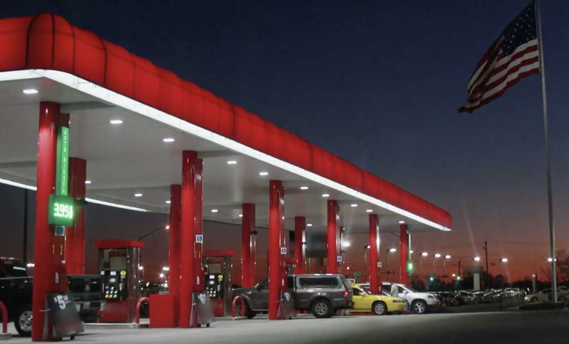 Cal's convenience store gas station and canopy featured at night